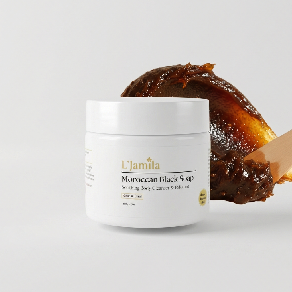 White jar of Moroccan Black Soap with a glossy dark soap mound on a serene white surface